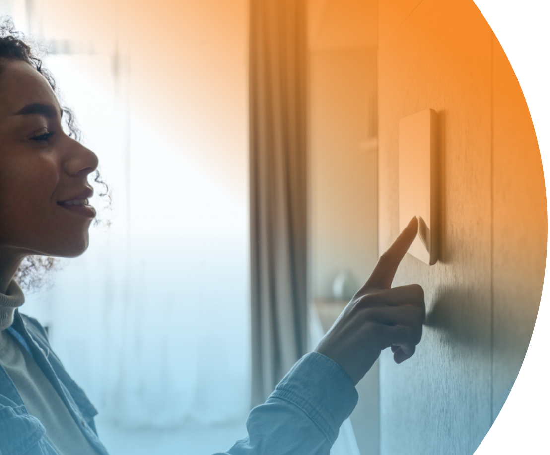 woman using hotel self check-in kiosk mounted on the wall